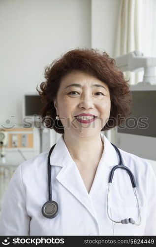 Portrait of smiling female doctor with a stethoscope looking at camera