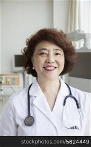 Portrait of smiling female doctor with a stethoscope looking at camera