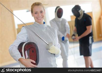 Portrait of smiling female fencer