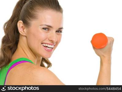 Portrait of smiling fitness young woman with dumbbell