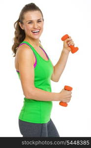 Portrait of smiling fitness young woman with dumbbells