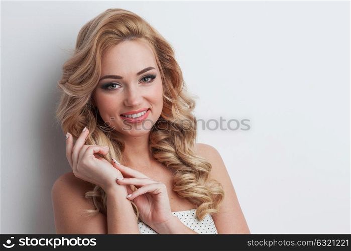 Portrait of smiling girl. Close-up portrait of smiling beautiful girl with blond curly hair