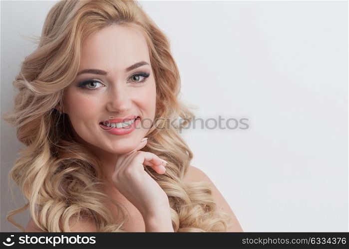 Portrait of smiling girl. Close-up portrait of smiling beautiful girl with blond curly hair