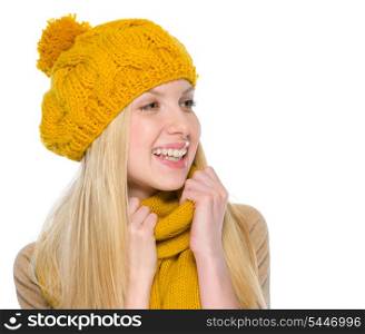 Portrait of smiling girl in autumn clothes looking on copy space
