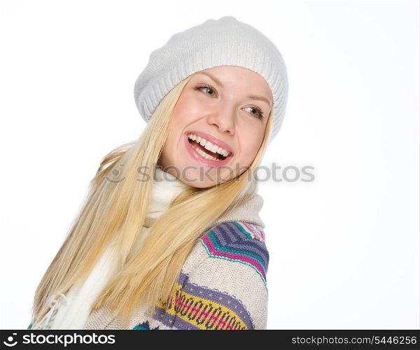 Portrait of smiling girl in winter clothes looking on copy space