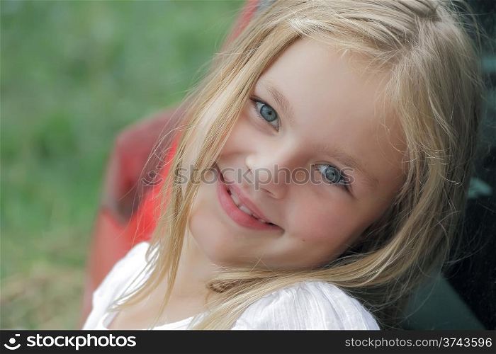 Portrait of smiling girl with blue eyes