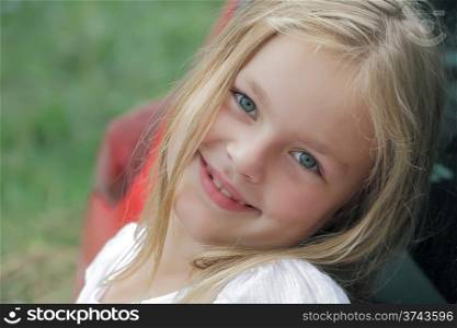 Portrait of smiling girl with blue eyes