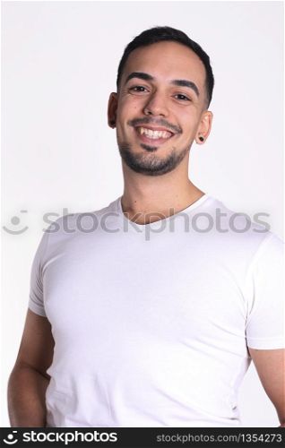 Portrait of smiling handsome man in white t-shirt looking at camera
