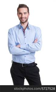 Portrait of smiling happy man in blue shirt and black pants with crossed arms - isolated on white.&#xA;