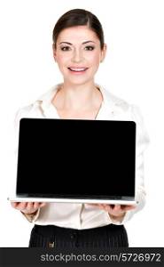 Portrait of smiling happy woman holds laptop on palm with blank screen - isolated on white. Concept communication.&#xA;