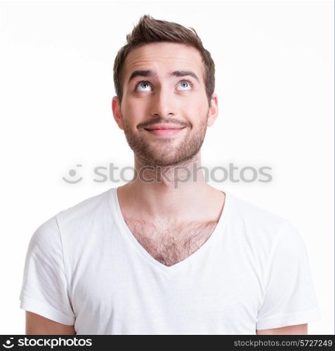 Portrait of smiling happy young man looking up - isolated on white.