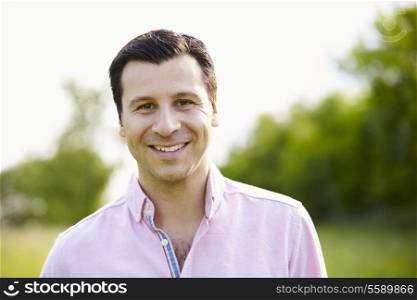 Portrait Of Smiling Hispanic Man In Countryside