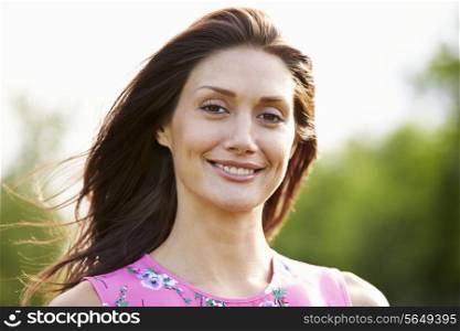 Portrait Of Smiling Hispanic Woman In Countryside