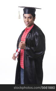 Portrait of smiling male graduate student against white background