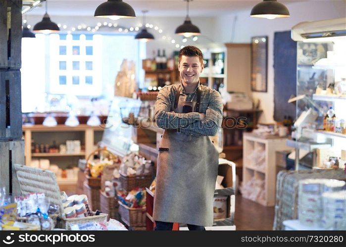 Portrait Of Smiling Male Owner Of Delicatessen Shop Wearing Apron