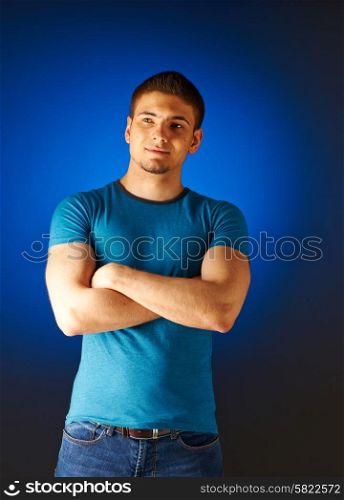 Portrait of smiling man against blue background