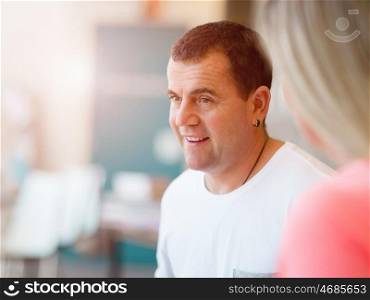 Portrait of smiling man indoors in casual clothes. Portrait of smiling man indoors