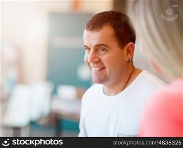 Portrait of smiling man indoors in casual clothes. Portrait of smiling man indoors