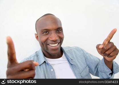 Portrait of smiling man showing thums up