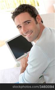 Portrait of smiling man working from home