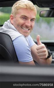 portrait of smiling mature car driver