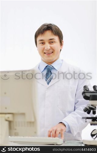 Portrait of smiling medical doctor working in laboratory