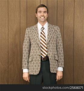 Portrait of smiling mid-adult Caucasian male in retro suit