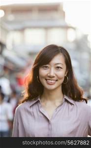 Portrait Of Smiling Mid Adult Woman In Houhai, Beijing