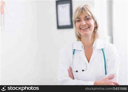 Portrait of smiling middle age doctor