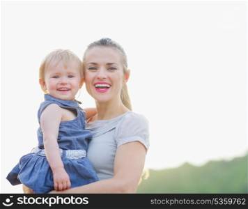 Portrait of smiling mom and baby