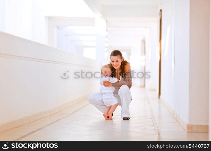 Portrait of smiling mother with cute baby &#xA;