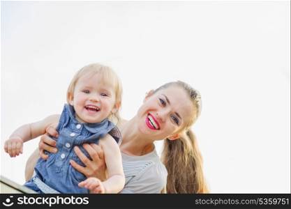 Portrait of smiling mother with kid