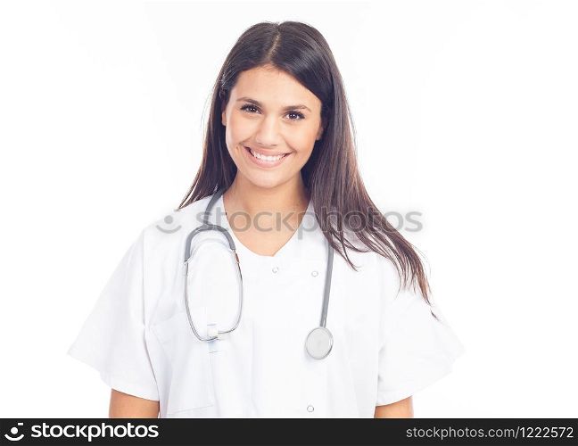 portrait of smiling nurse or brunette doctor in white coat with stethoscope