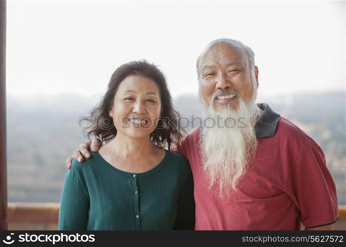 Portrait Of Smiling Old Couple In Jing Shan Park