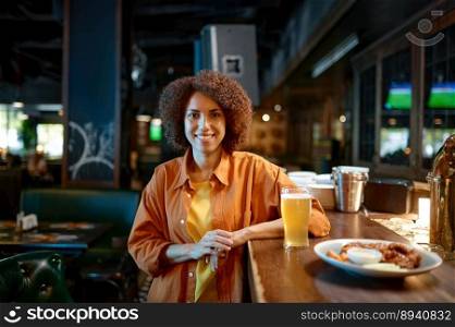 Portrait of smiling pretty woman standing at sports bar counter desk and looking at camera. Portrait of smiling pretty woman at sports bar counter desk