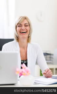 Portrait of smiling senior business woman at office