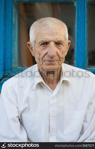 portrait of smiling senior man close-up