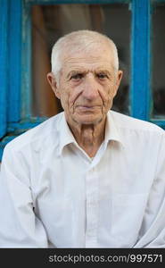 portrait of smiling senior man close-up