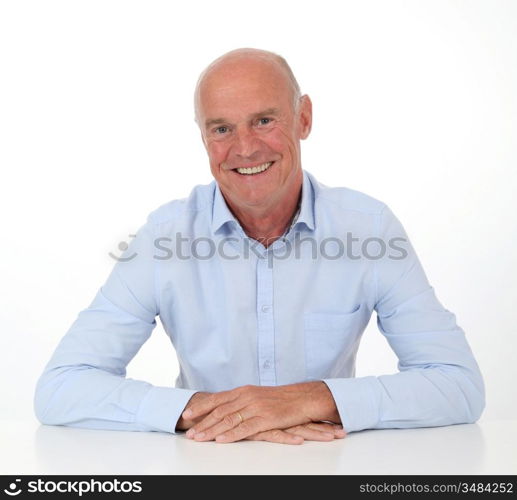Portrait of smiling senior man on white background