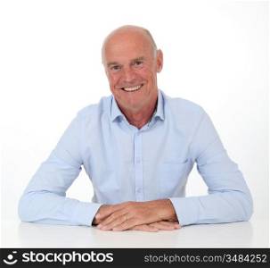 Portrait of smiling senior man on white background