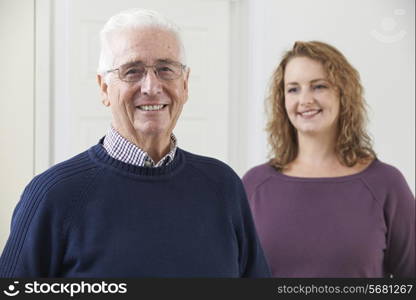 Portrait Of Smiling Senior Man With Adult Daughter