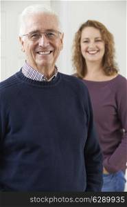 Portrait Of Smiling Senior Man With Adult Daughter