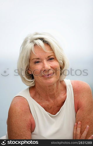 Portrait of smiling senior woman outdoors