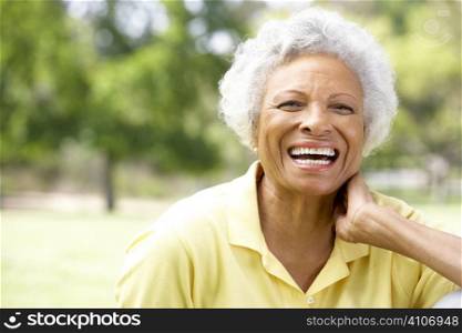 Portrait Of Smiling Senior Woman Outdoors