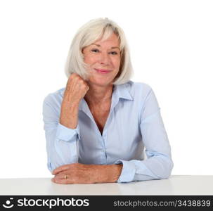 Portrait of smiling senior woman with blue shirt