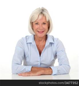 Portrait of smiling senior woman with blue shirt
