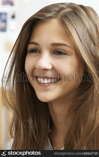 Portrait Of Smiling Teenage Girl At Home