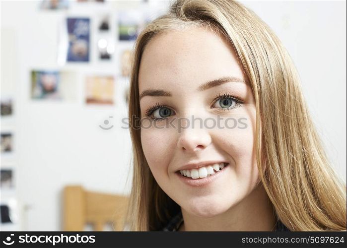 Portrait Of Smiling Teenage Girl At Home