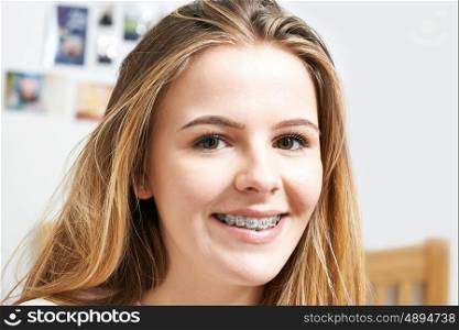 Portrait Of Smiling Teenage Girl Wearing Dental Braces