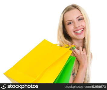 Portrait of smiling teenage girl with shopping bags